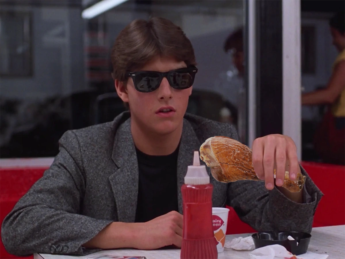 Tom Cruise in the 1983 film Risky Business holding a turkey leg